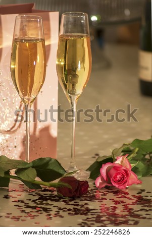 Roses, champagne, petal and heart shaped confeti, some effects used to remove certain colours from image and median noise reduction also used on some images to produce a faded look,