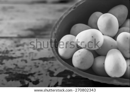 mini eggs laying on a wooden background