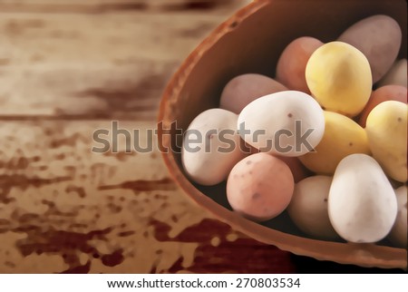 Illustration of mini eggs laying on a wooden background