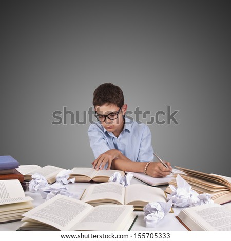 girl studying at the desk with lot of work desk