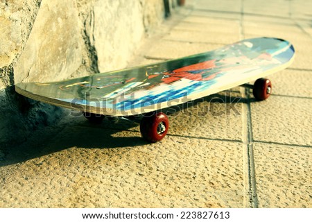 skateboard in the foreground, toys and sporting goods