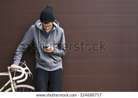 man with mobile phone and bicycle
