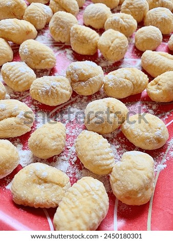 Similar – Image, Stock Photo Homemade gnocchi preparation on rustic kitchen table with ingredients. Top view. Potatoes dough . Italian food concept.