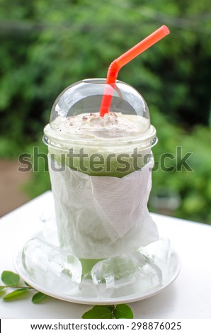 Close up Milk Green tea smoothie in plastic cup isolated