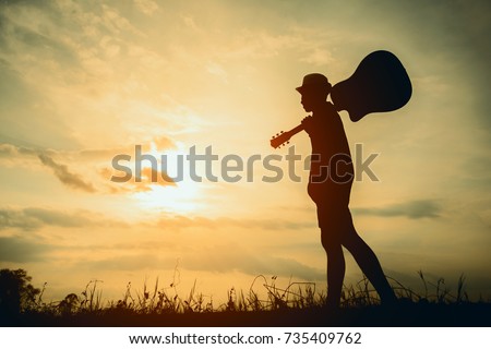 Similar – Image, Stock Photo Musician holding guitar at seaside