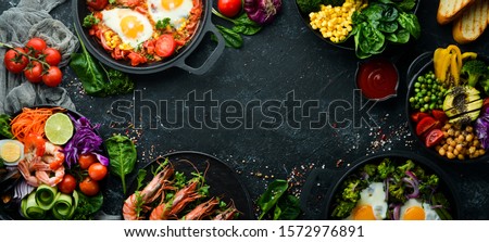 Dishes background. Set of dishes on the dining table. Food. Traditional cuisines of the world. Top view. Free space for your text.