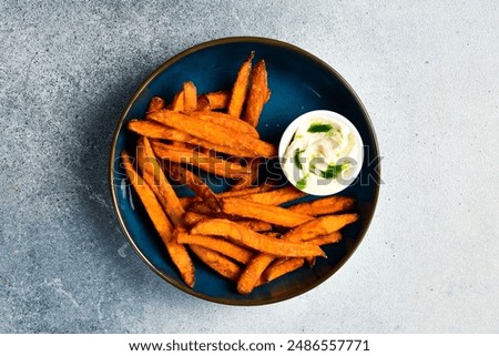 Similar – Foto Bild Süßkartoffelpommes in einer Schüssel auf dem Tisch