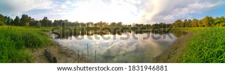 Similar – Image, Stock Photo ***3000*** Reflection of sun in puddle with ice and foliage closeup bokeh