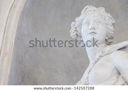 Ancient statue of a young woman in an Italian church close to Torino, north Italy