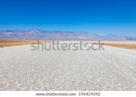 USA, Death Valley. Badwater point: salt road in the middle of the desert