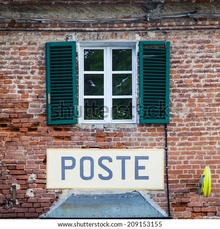 Tuscany, Italian postal office sign on old wall.