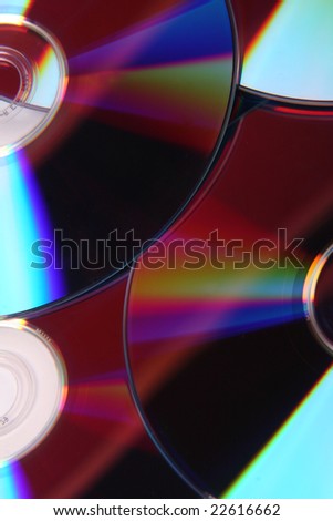 cd dvd disc unsorted on the ground with light effect