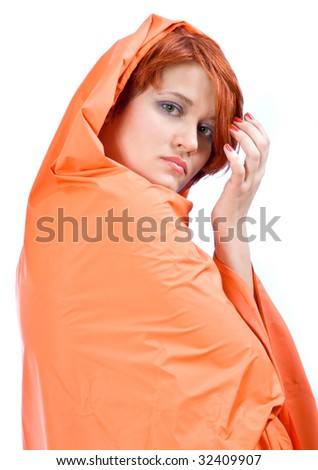 Red-haired girl in red cover on a white background