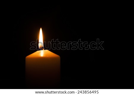 calm, bright, can be romantic or festive light candles on a black background. The light in the darkness.