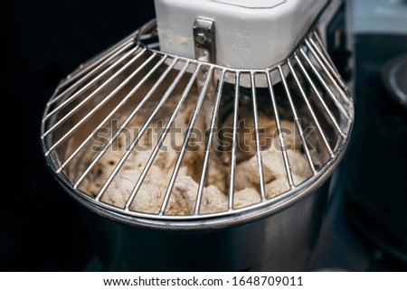 Similar – Image, Stock Photo A dough is kneaded on a kitchen table and dusted with flour