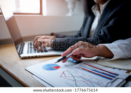 Business man financial inspector and secretary making report, calculating or checking balance. Internal Revenue Service inspector checking document. Audit concept Stock foto © 
