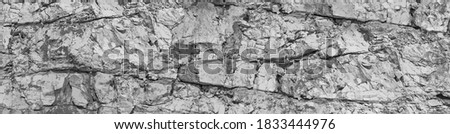 Solid particles fragments, gaps split, cavity, groove track on sharp stones. Debris pieces, scratch marks on cut ruined blocks rock.Gray dirt bump map, old grunge steep cliff for 3d grayscale backdrop