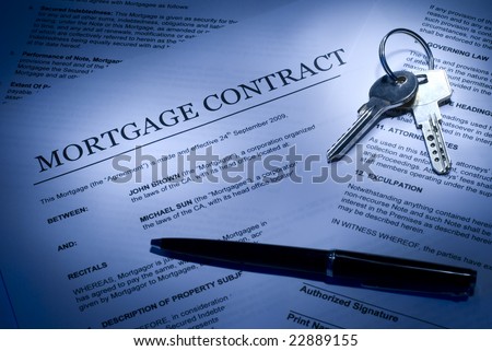 Mortgage contract for sale of real estate property with a pen and house keys