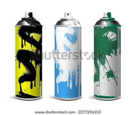 A set of used spray cans with multi-colored paint.
