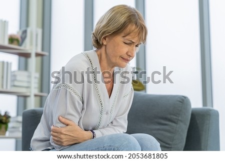 Similar – Image, Stock Photo Senior woman feeling pain while consulting doctor on her smart phone