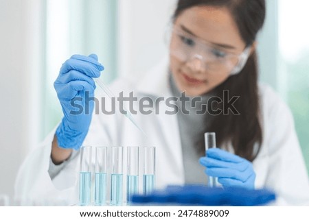 Similar – Image, Stock Photo Hand with analysis tube on blue background with copy space