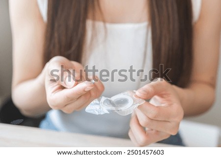 Similar – Image, Stock Photo Young woman wearing a mask while use her smartphone