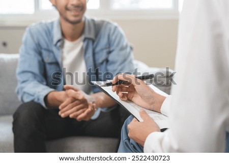 Image, Stock Photo doctor man taking a break, using mobile phone. Wearing protective gloves, mask and stethoscope. coronavirus covid-19 concept
