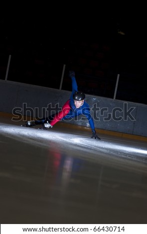 Man speed skating in sharp turn