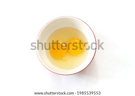 Similar – Image, Stock Photo Eggs in a bowl and baking ingredients on a kitchen table. Rustic.