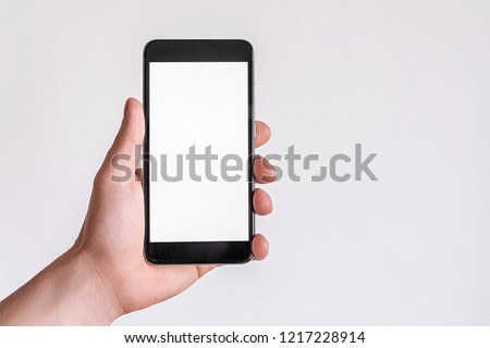 Female hand model mockup with black mobile phone with white screen on isolated background. ストックフォト © 