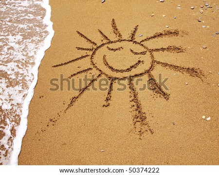 On damp yellow sand the smiling sun is drawn