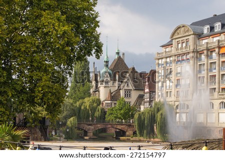 city fountain on the background of beautiful homes