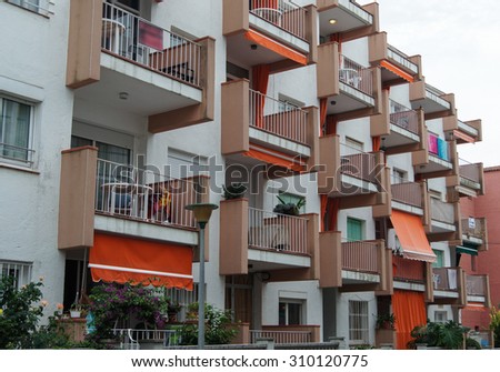 Giverola, Andorra - July 29, 2015.\
The building is a modern type with tables on the balconies.