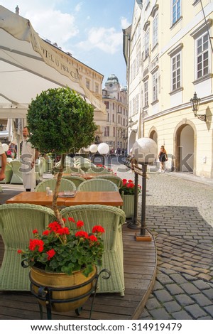 Prague, Czech Republic - 12, June, 2015.Original wicker chairs in a cozy street restaurant.