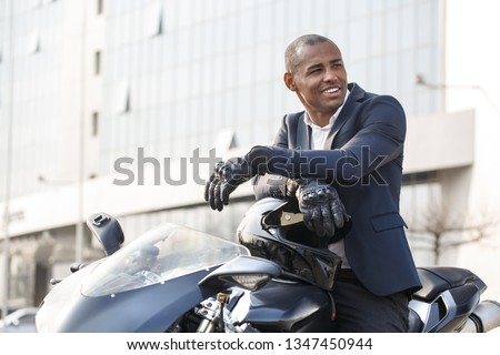 Similar – Image, Stock Photo Man sitting on motorcycle and surfing mobile