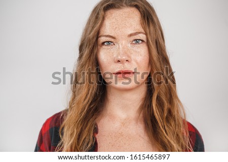 Similar – Image, Stock Photo Confident pensive freckled woman smoking on bed