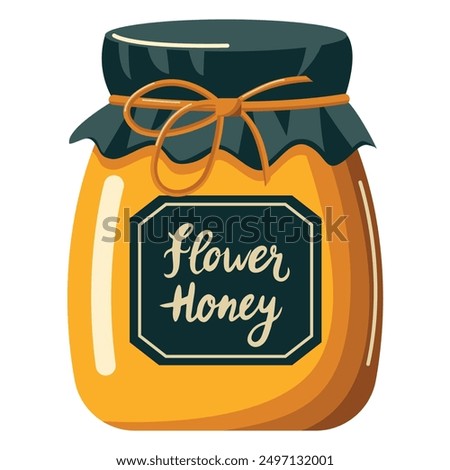 A jar of honey with a black lid and a black label that says Flower Honey. The jar is yellow and has a black ribbon around it