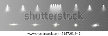 A set of light effects with a white glow spotlight on a transparent background. Vector