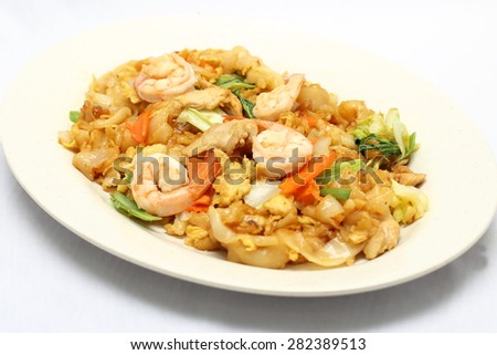 Stair fried flat noodles kwetiau with seafood