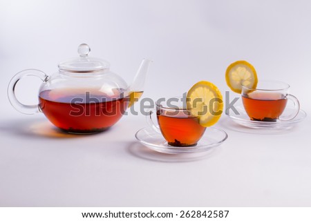 Tea serving. Tea set. Black tea with lemon.