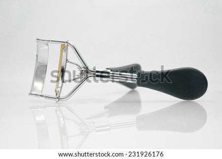 Eyelash curler isolated on white background