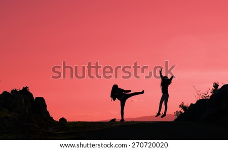 silhouettes of people on mountains