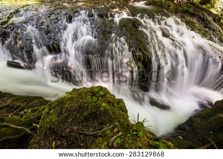Waterfall Landscape in the Mountains, Slow Shutter Speeds. Small Waterfall.
