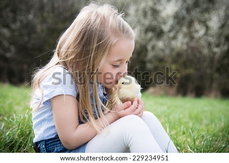 little girl with chicken