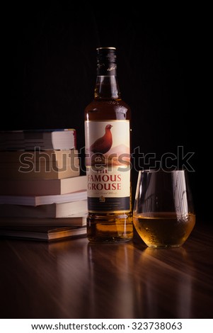 Zagreb, Croatia - October 3, 2015: Props and bottle of The Famous Grouse Finest Scotch Whisky 40%, 700ml. Blended whisky, one of the world\'s most popular blends. Imported from Scotland