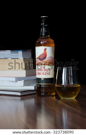 Zagreb, Croatia - October 3, 2015: Props and bottle of The Famous Grouse Finest Scotch Whisky 40%, 700ml. Blended whisky, one of the world\'s most popular blends. Imported from Scotland