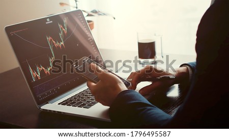investment stockbroker profit analysis. Stock trading graph price prediction and profit gain. Trade graph chart bitcoin. Financial manager workplace desk 