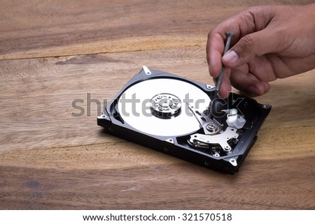 Use Screwdriver to remove screw to check Hard Disk Drive