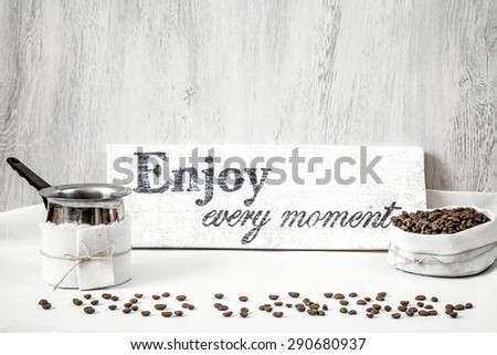 Roasted coffee beans with pitcher for making coffee