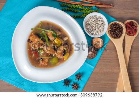 Noodle in fried bean fish topped pepper with decoration and background shooting menu set